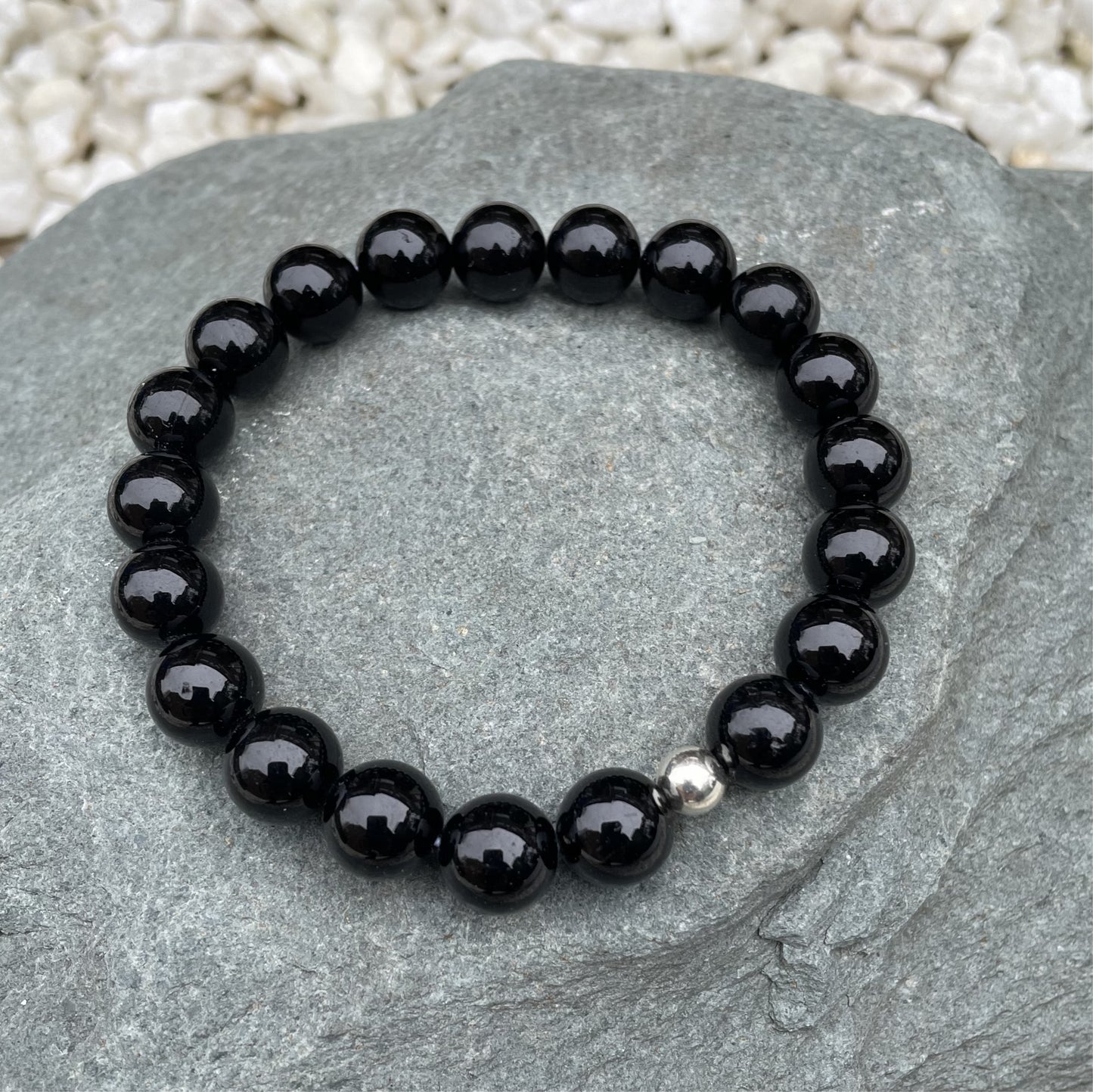 Black crystal bead bracelet on stone