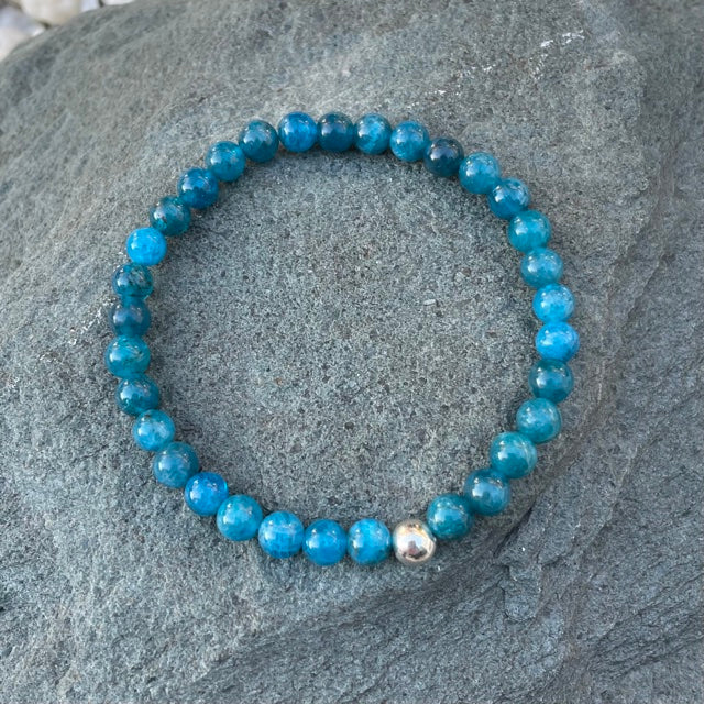 Blue crystal stretch bracelet on stone