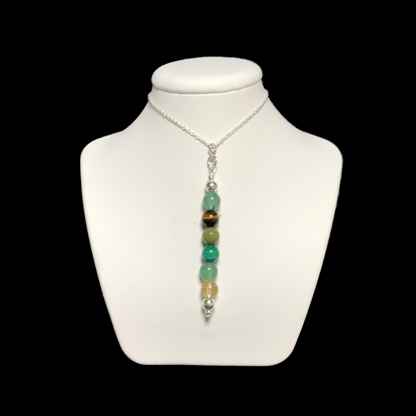 Abundance beaded crystal pendant on a white stand