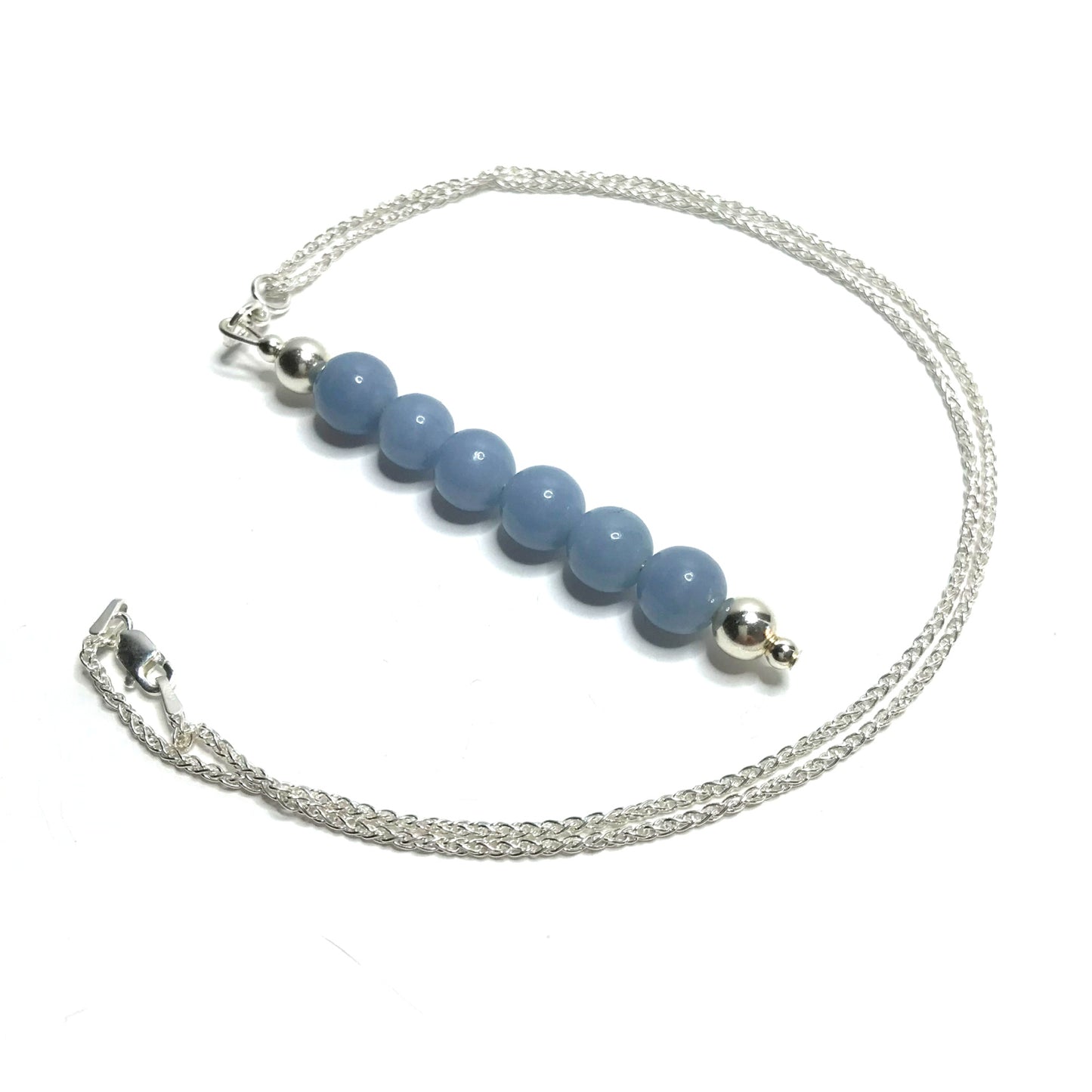 Light blue gemstone pendant on a sterling silver chain