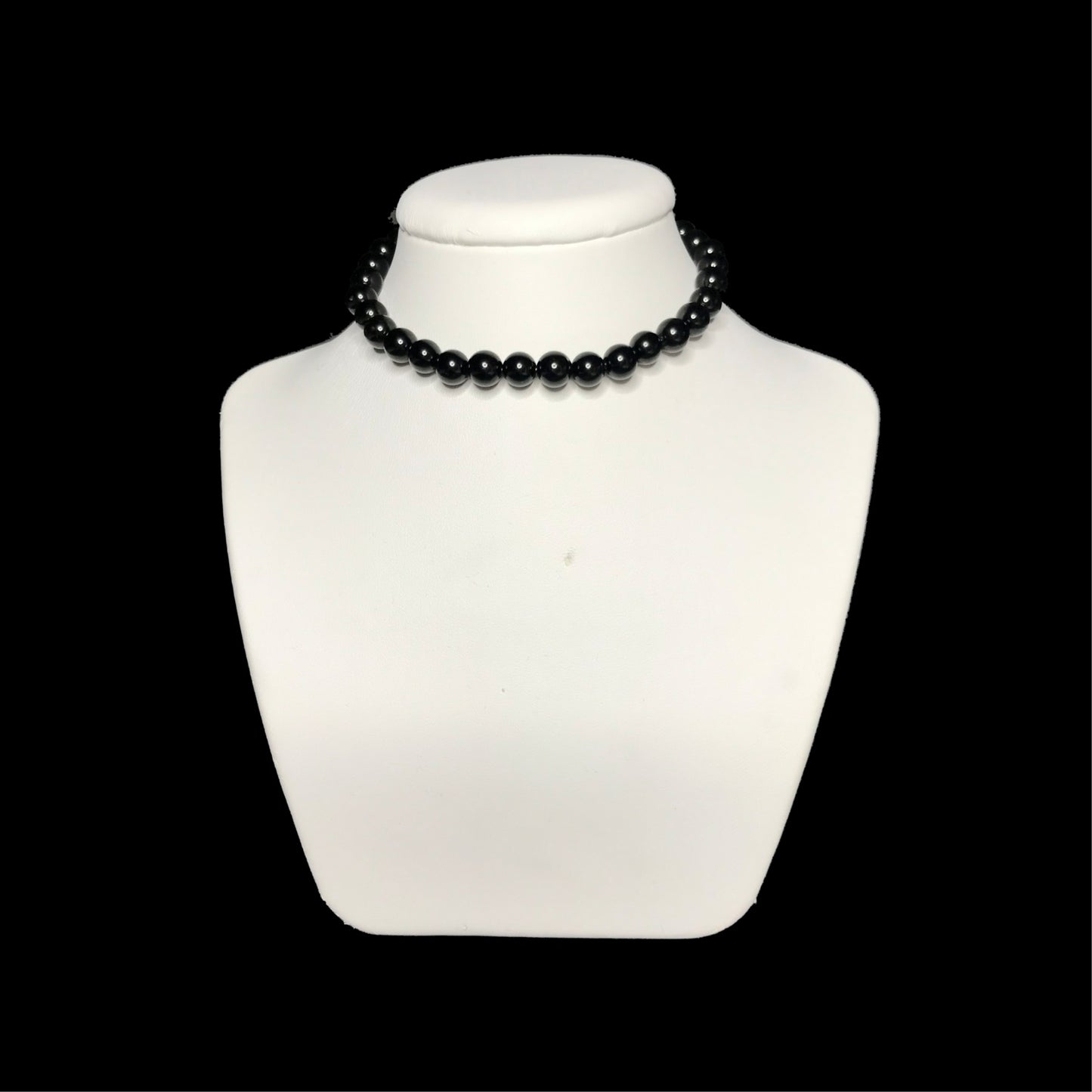 Black crystal beaded choker on white stand