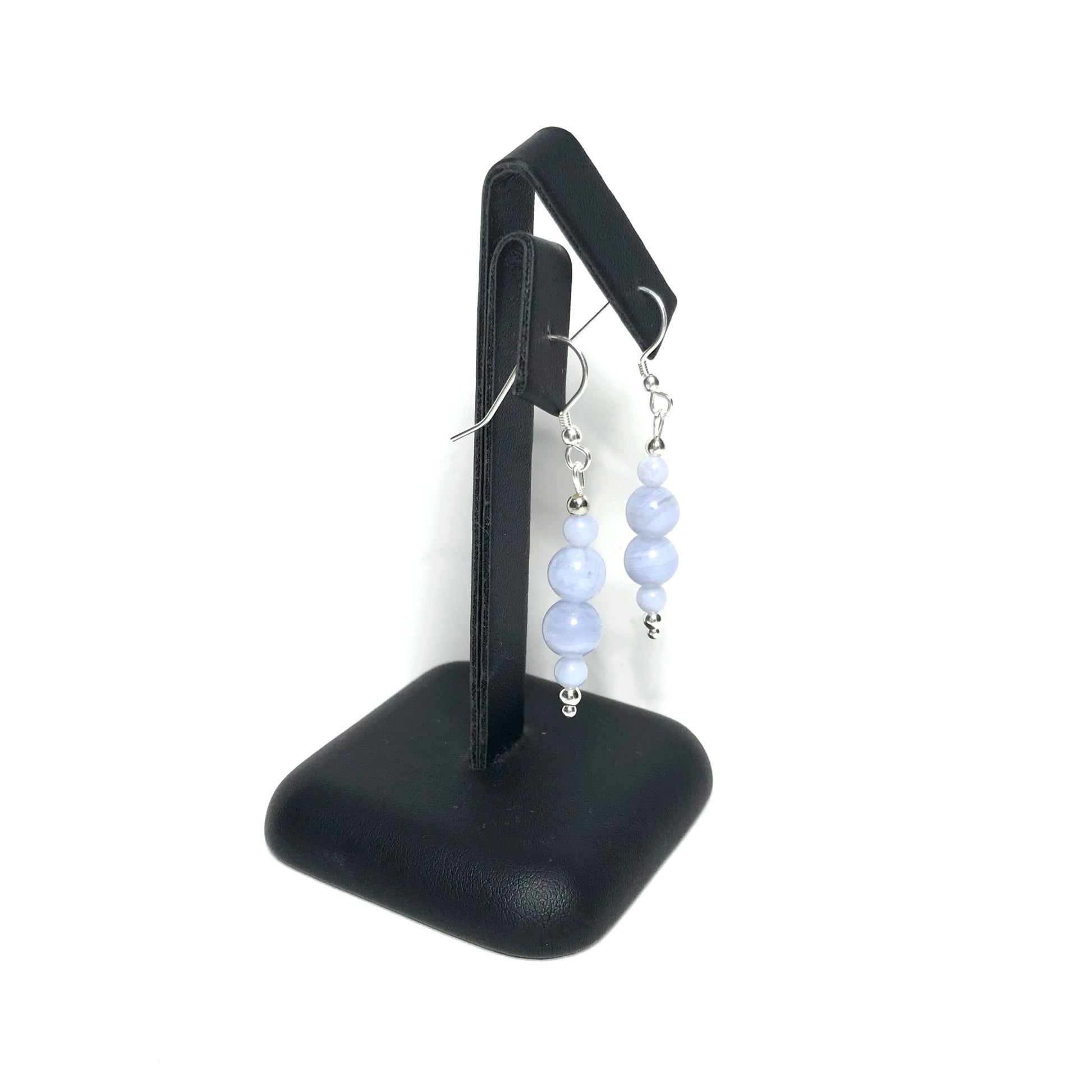 Blue lace agate crystal drop earrings on stand