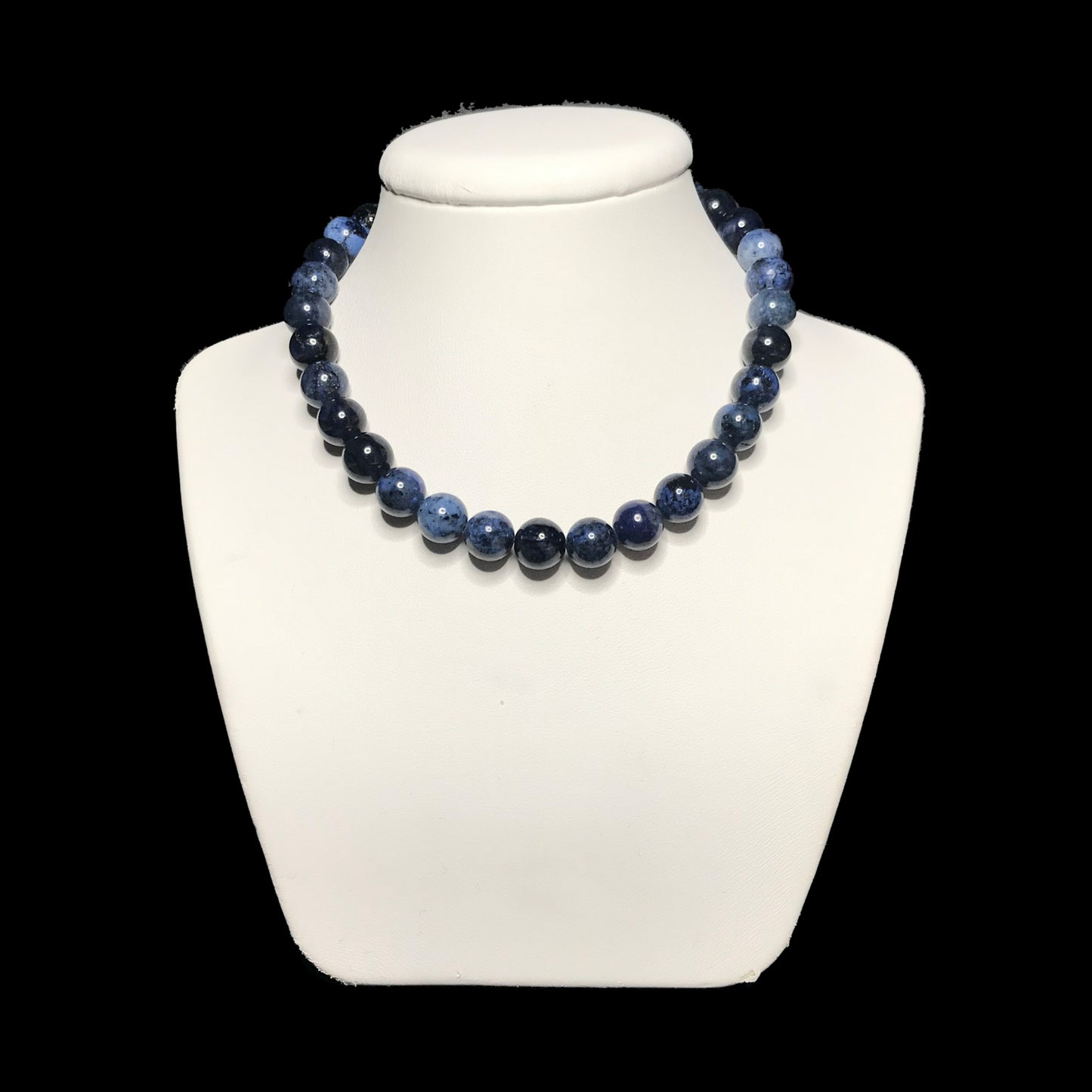 Dumortierite beaded necklace on stand