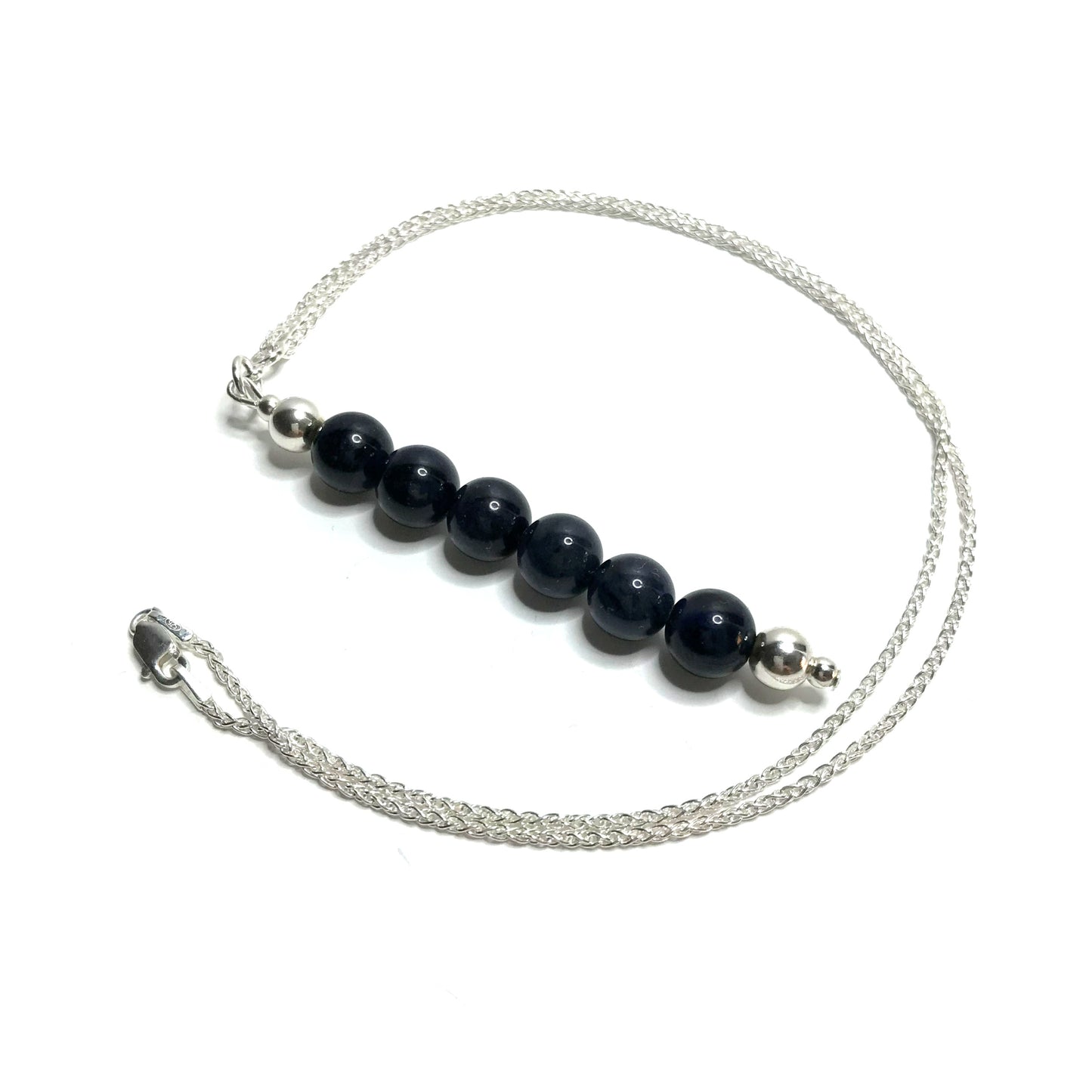 Dumortierite crystal pendant on a silver chain