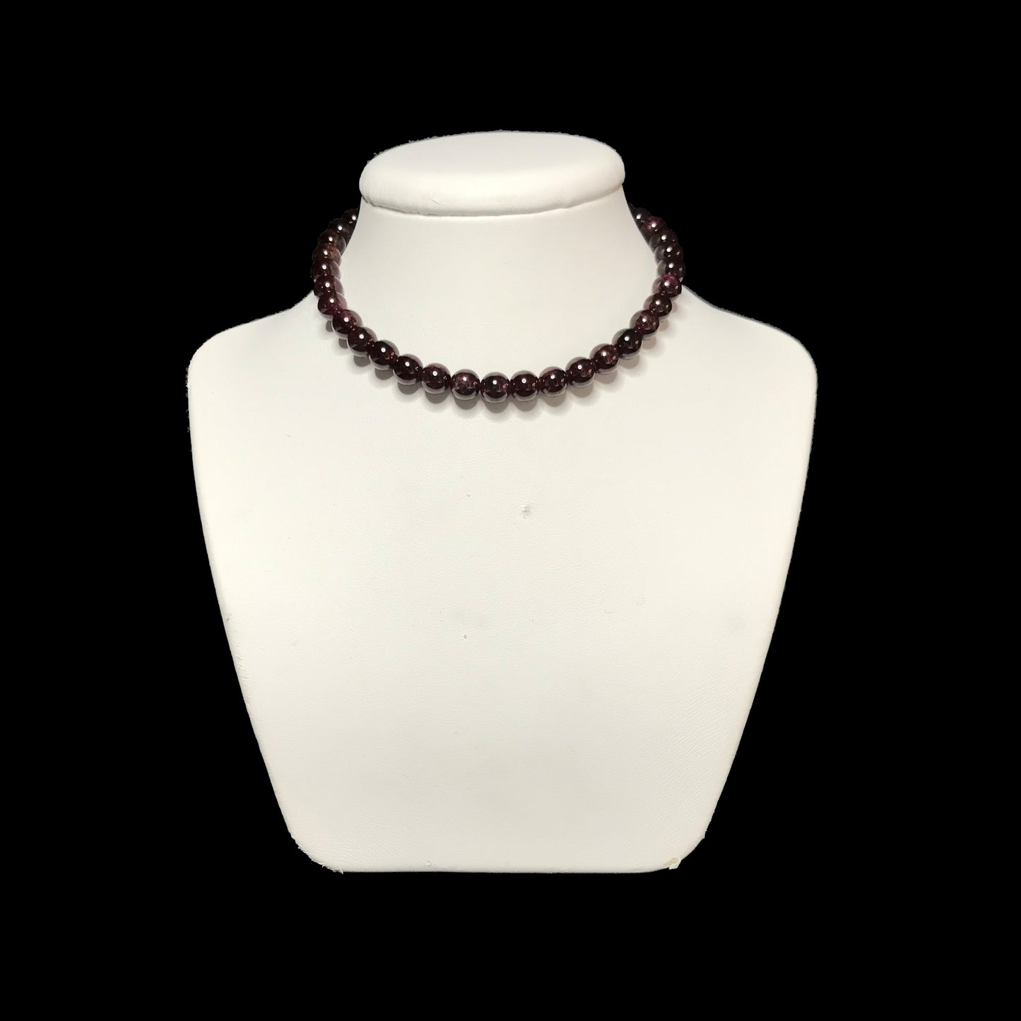 Garnet choker on stand