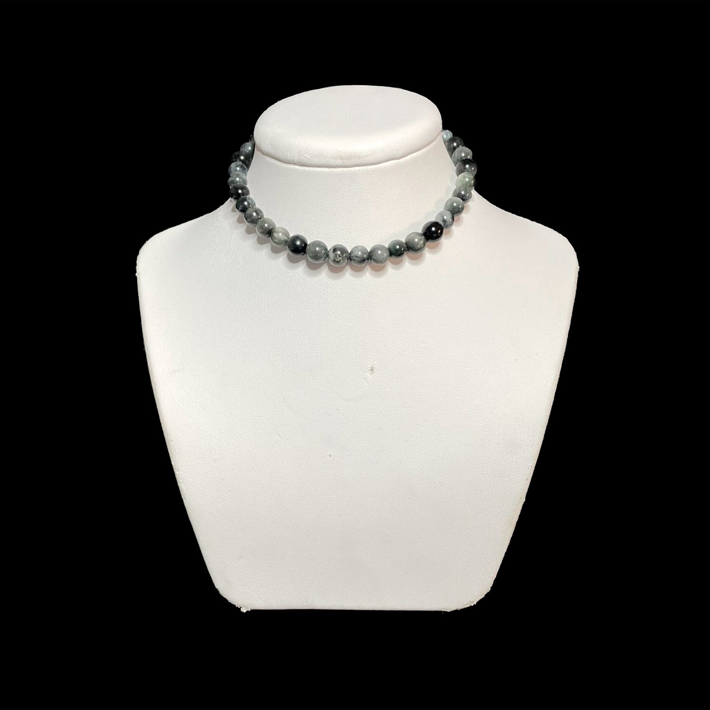 Hawk eye crystal choker on white stand