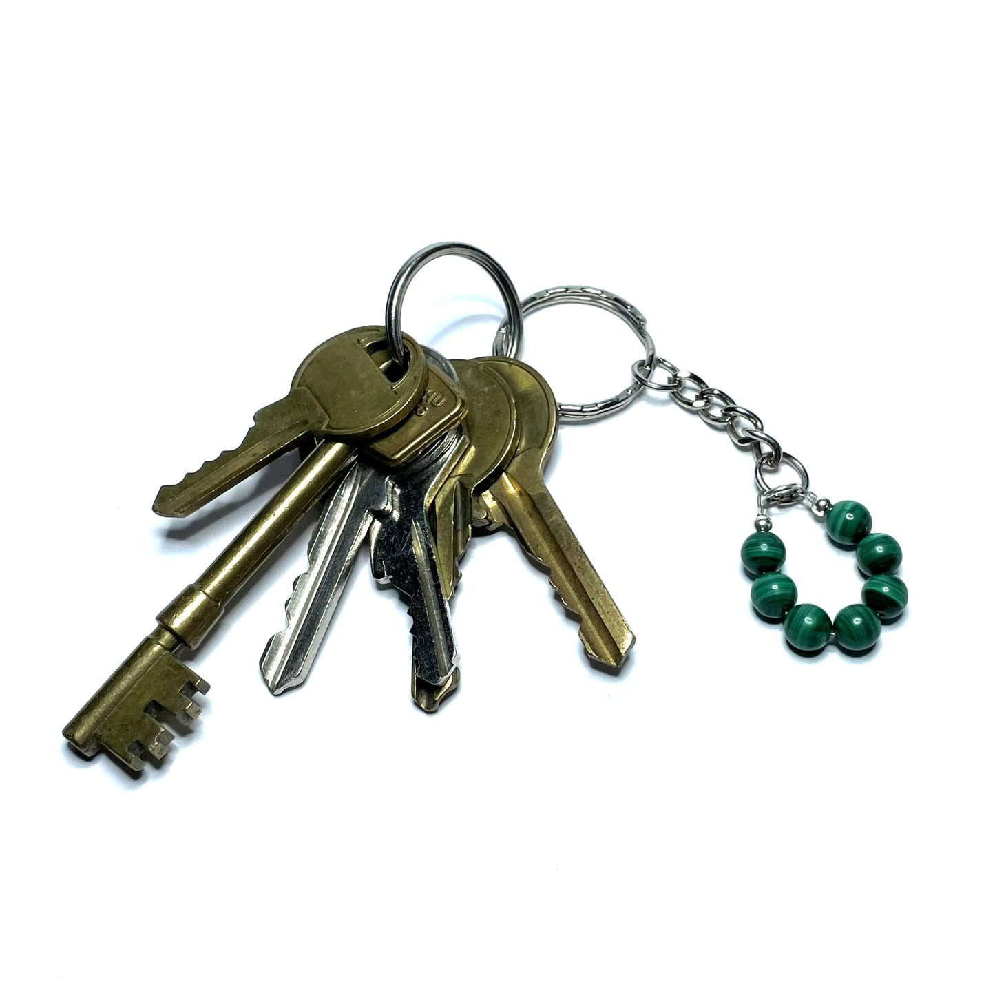 Green gemstone keychain with a set of keys