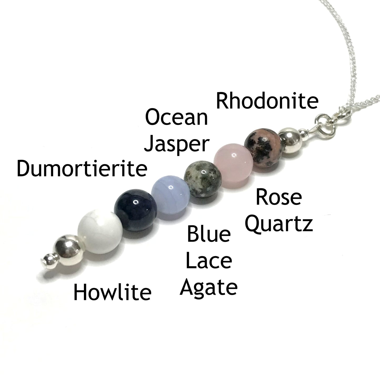 Patience pendant with the beads labelled as rhodonite, rose quartz, ocean jasper, blue lace agate, dumortierite and howlite