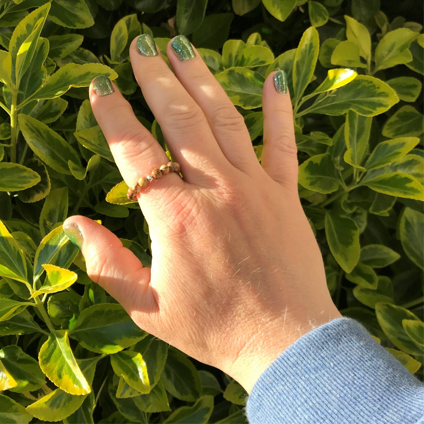 Hand wearing picture jasper beaded stretch ring