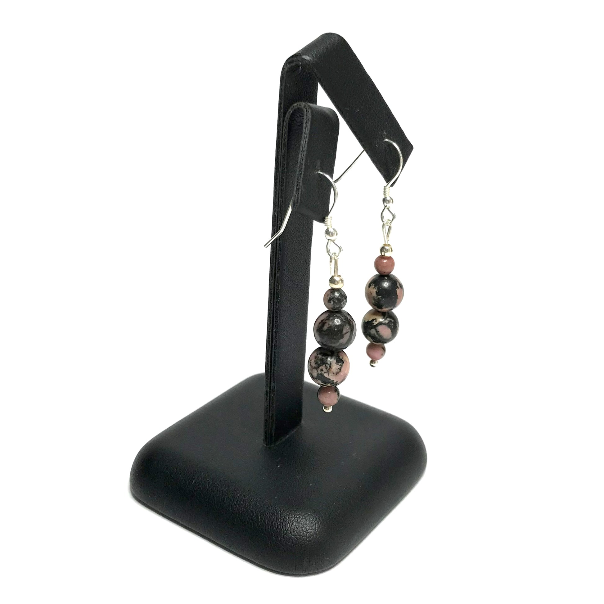 Rhodonite earrings on a stand