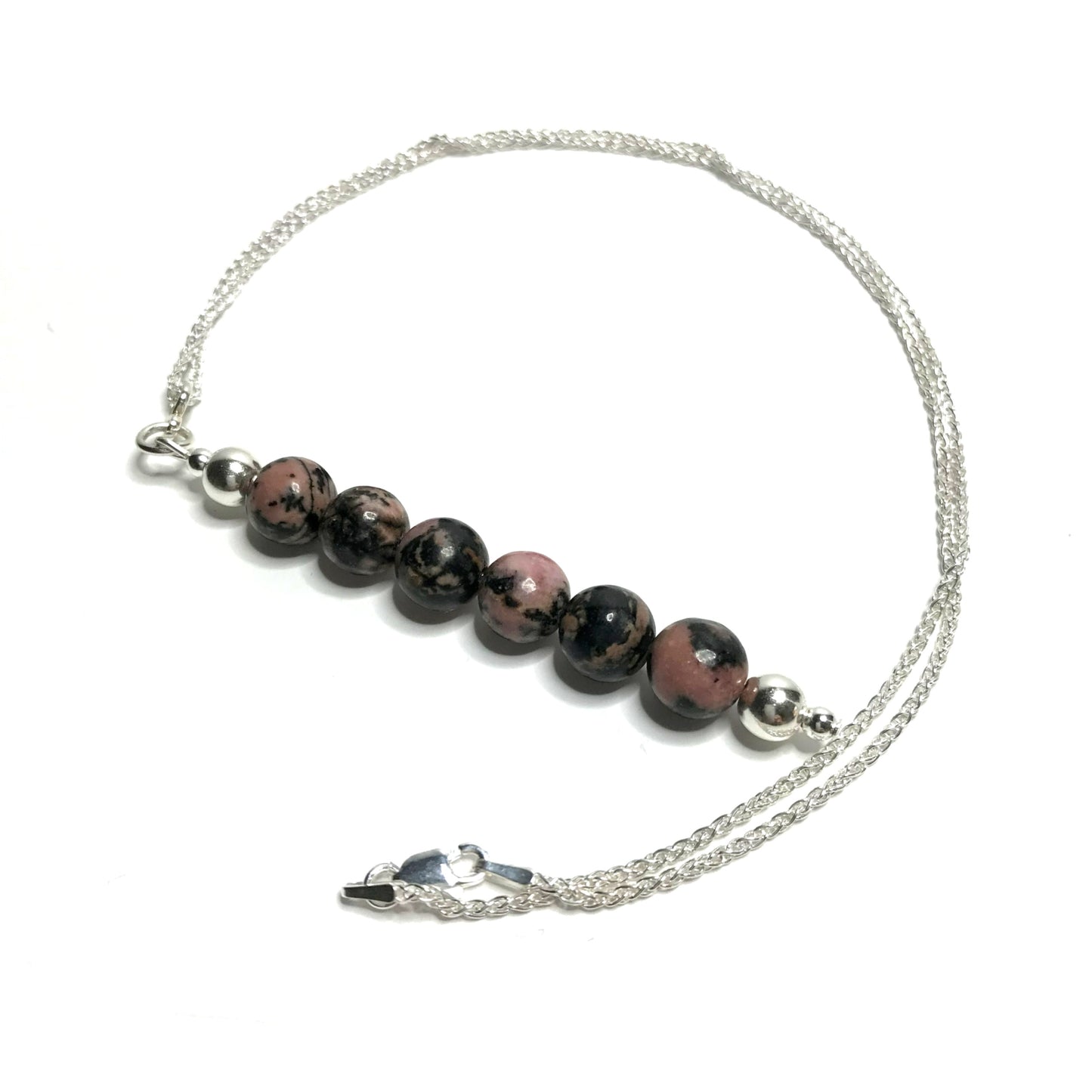 Rhodonite bead pendant on a sterling silver chain