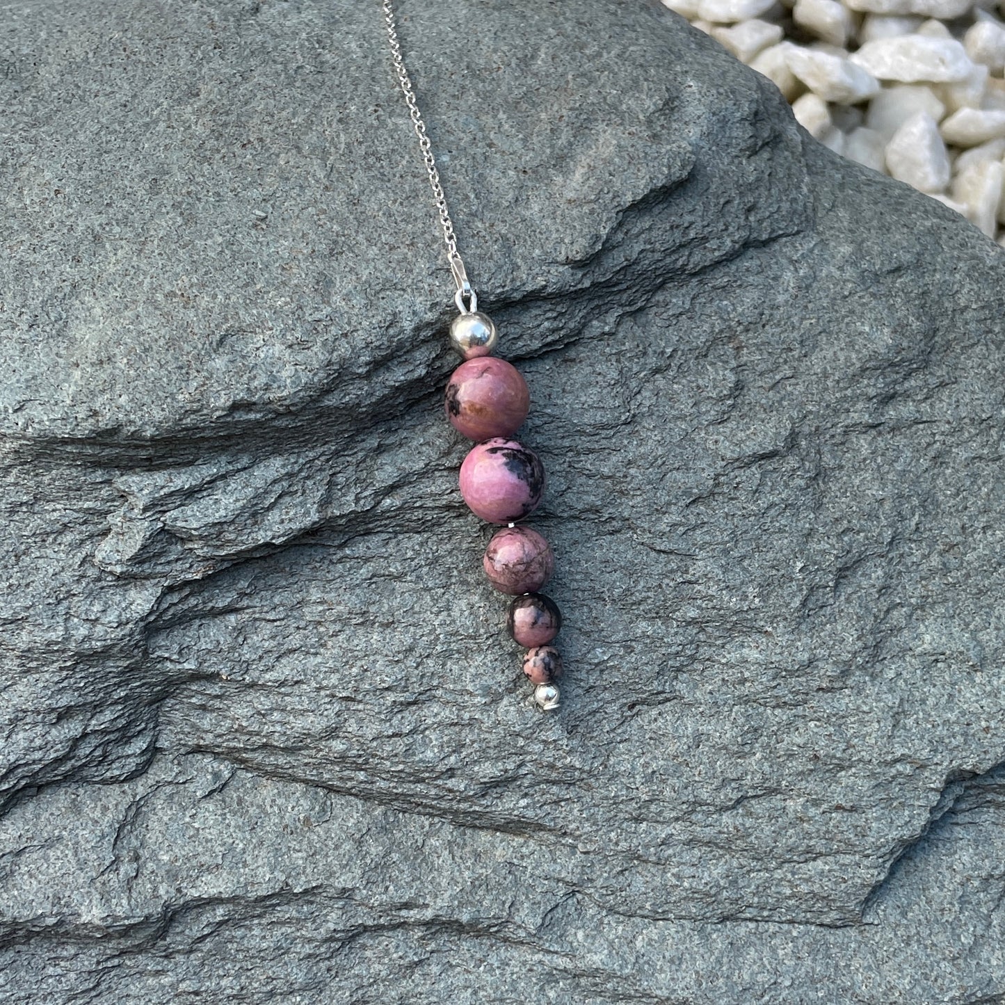 Rhodonite crystal pendulum