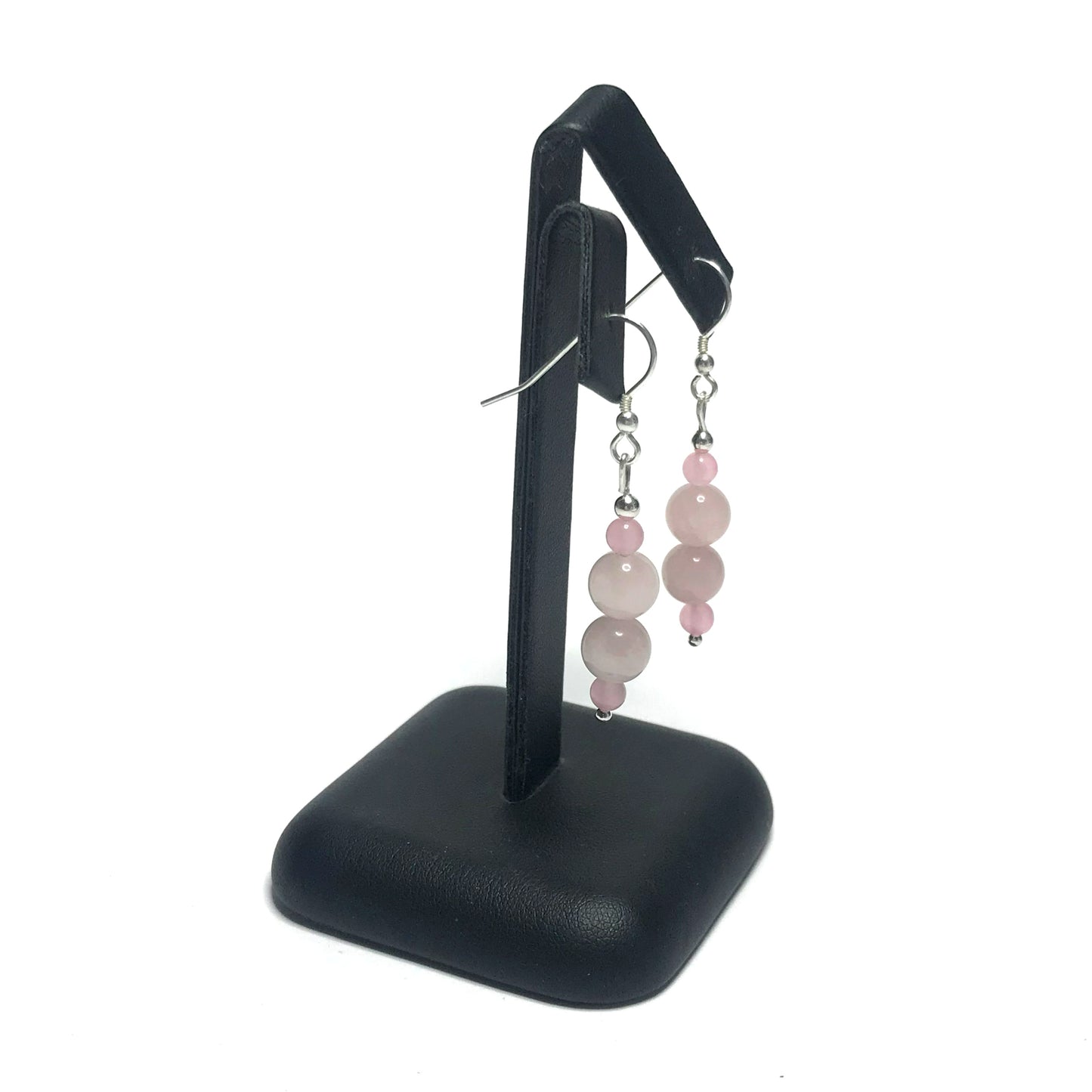 Rose quartz drop earrings on stand