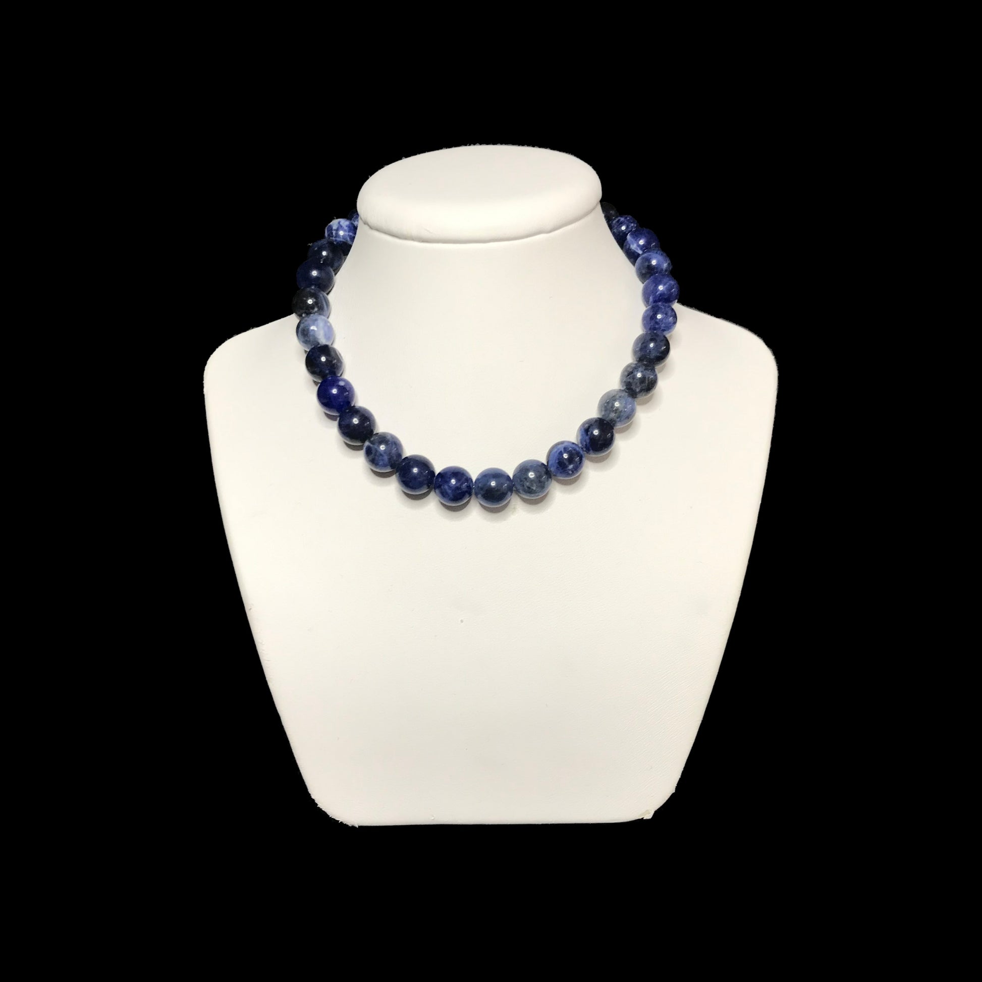 Sodalite crystal necklace on stand 
