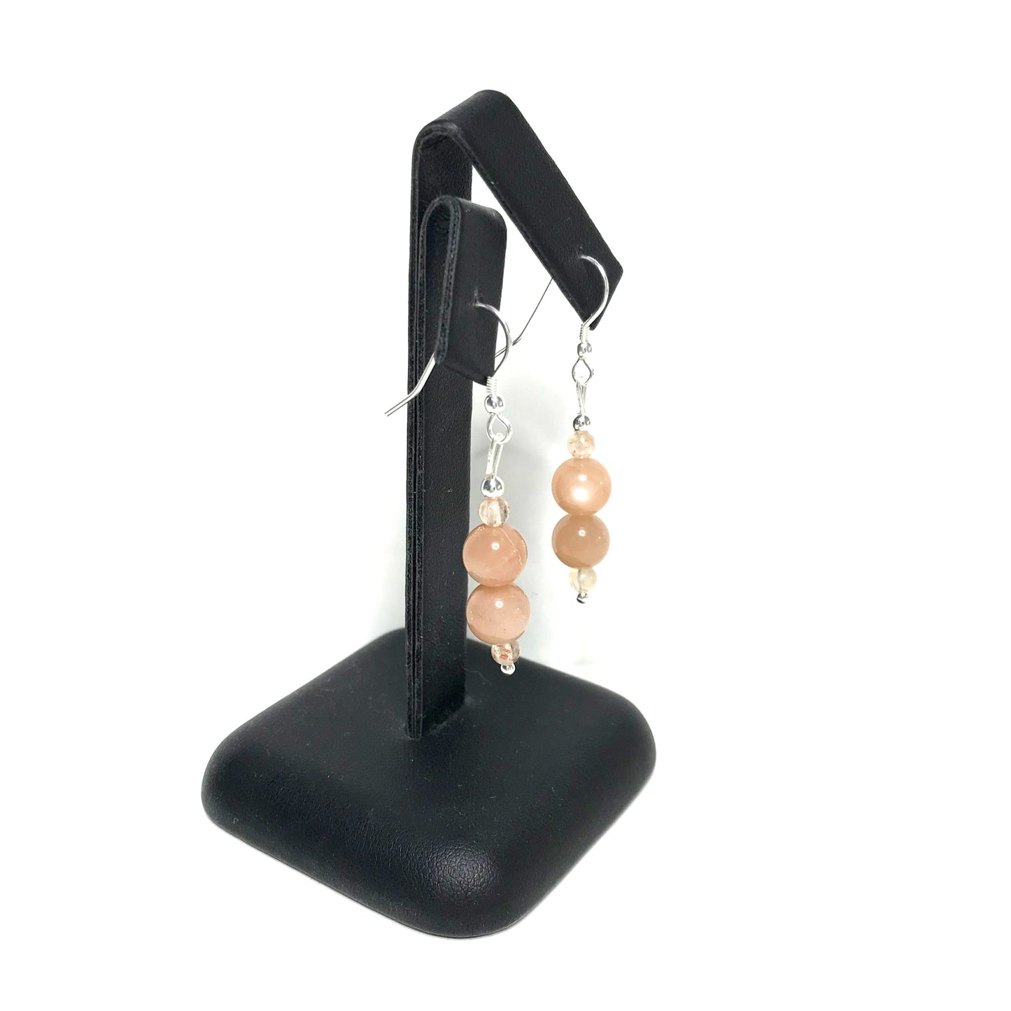 Sunstone drop earrings on stand