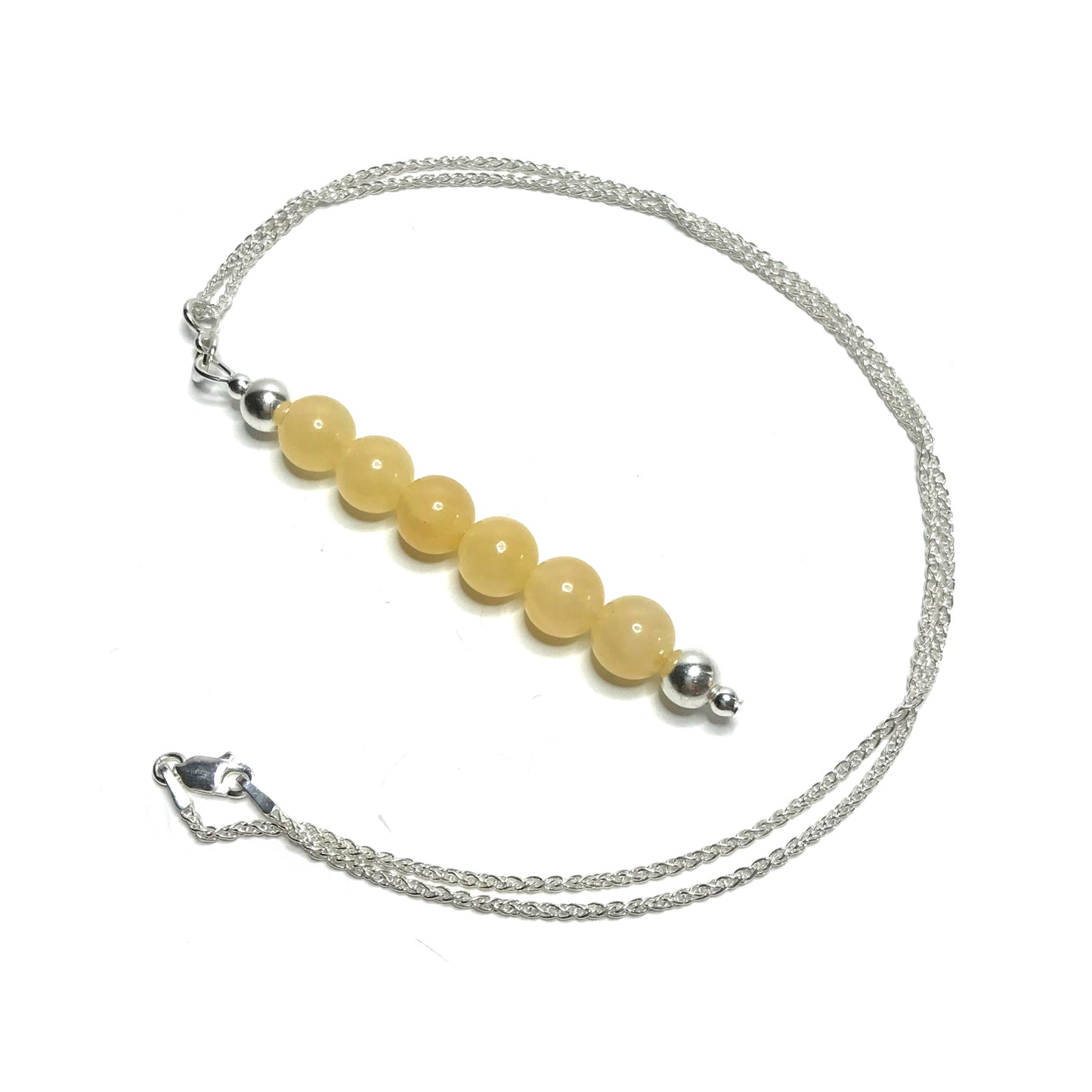 Yellow gemstone pendant with a sterling silver chain