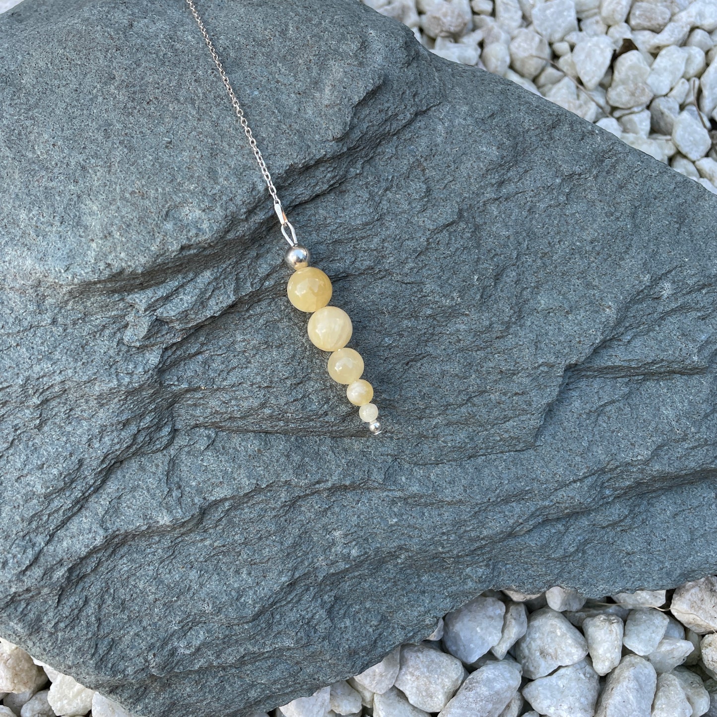 Yellow calcite crystal pendulum