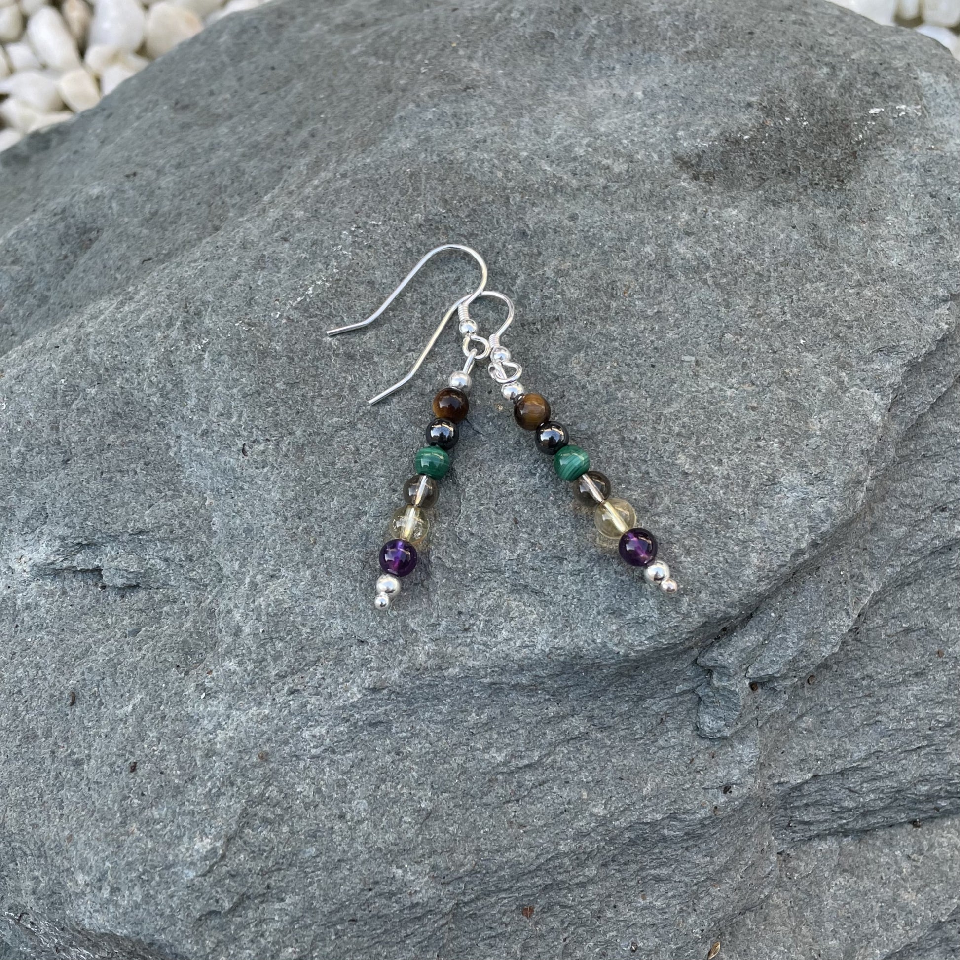 Addiction recovery beaded earrings on stone
