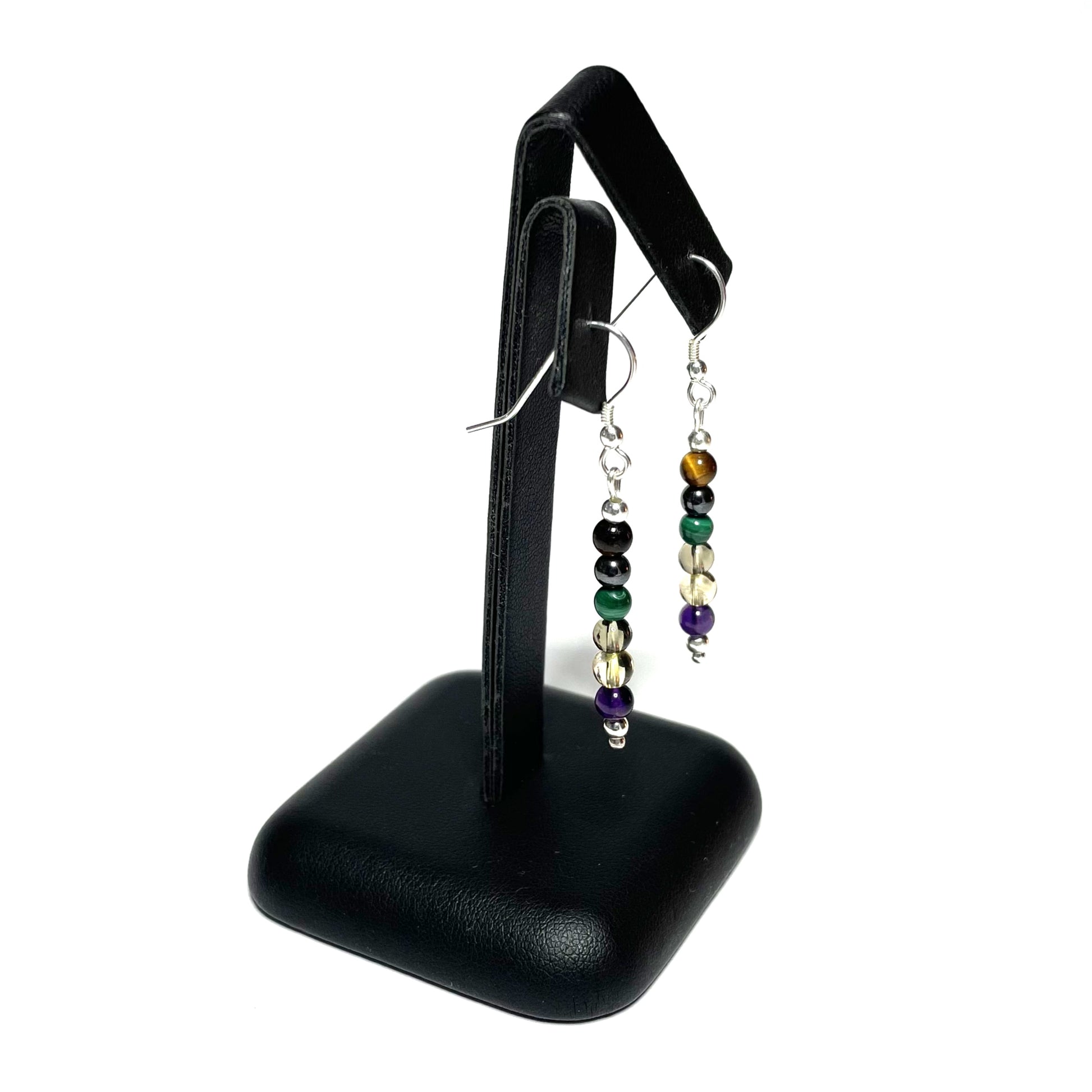 Addiction recovery crystal earrings on stand