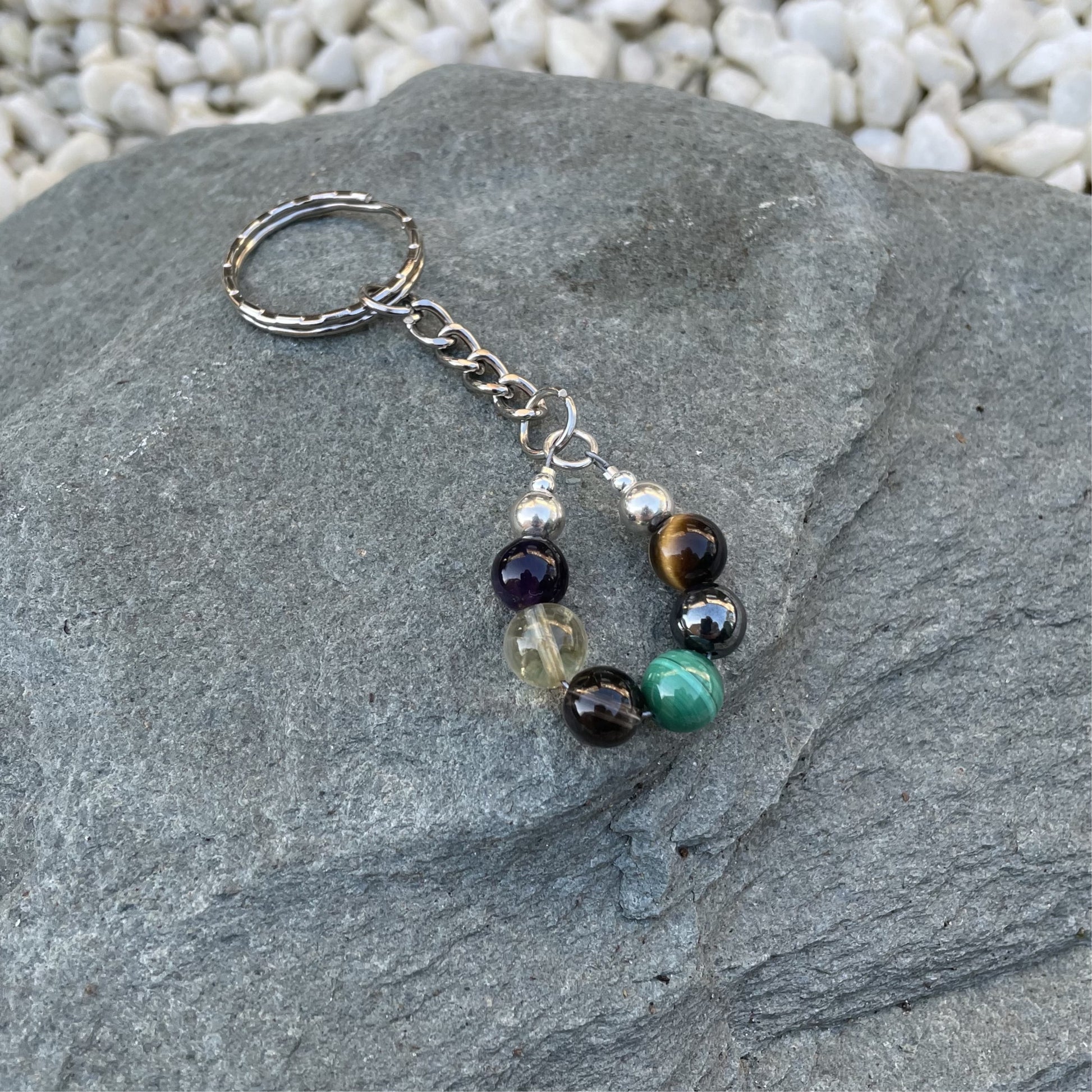 Addiction recovery crystal keychain on stone