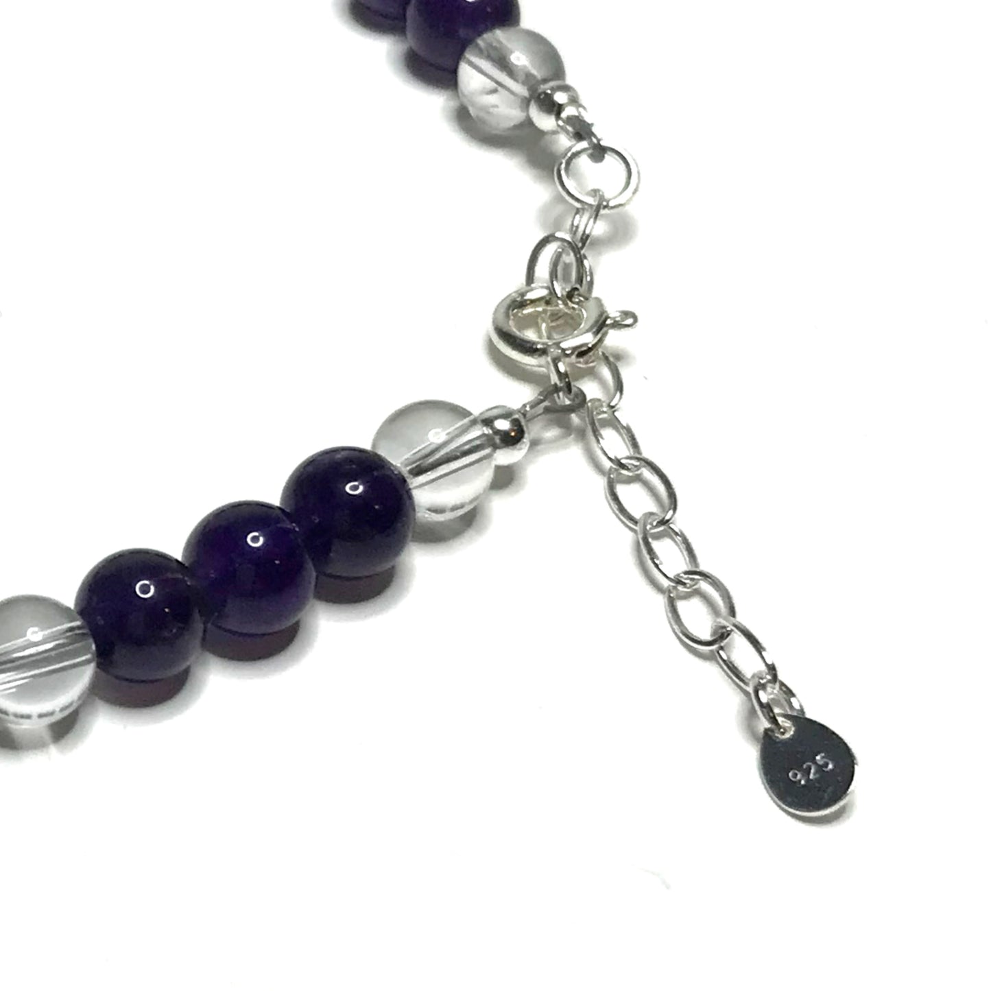 Close up of the sterling silver extender chain on a handmade amethyst and clear quartz beaded anklet.