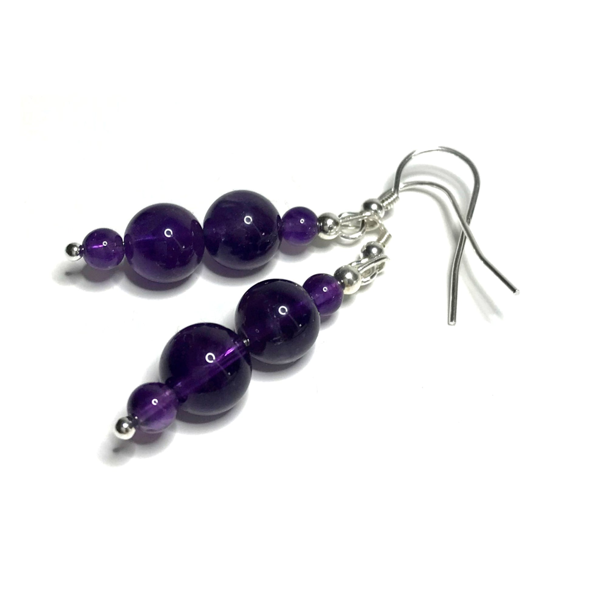 A pair of handmade amethyst dangle earrings.