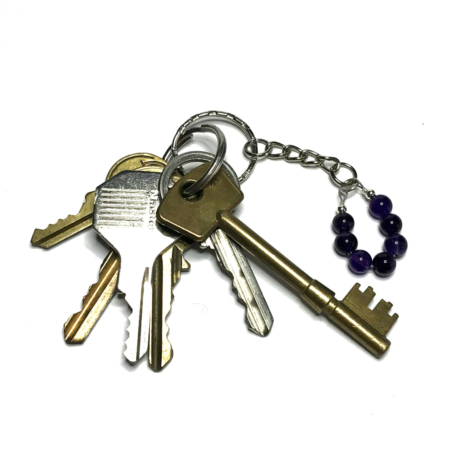 Purple crystal bead keychain with a set of keys