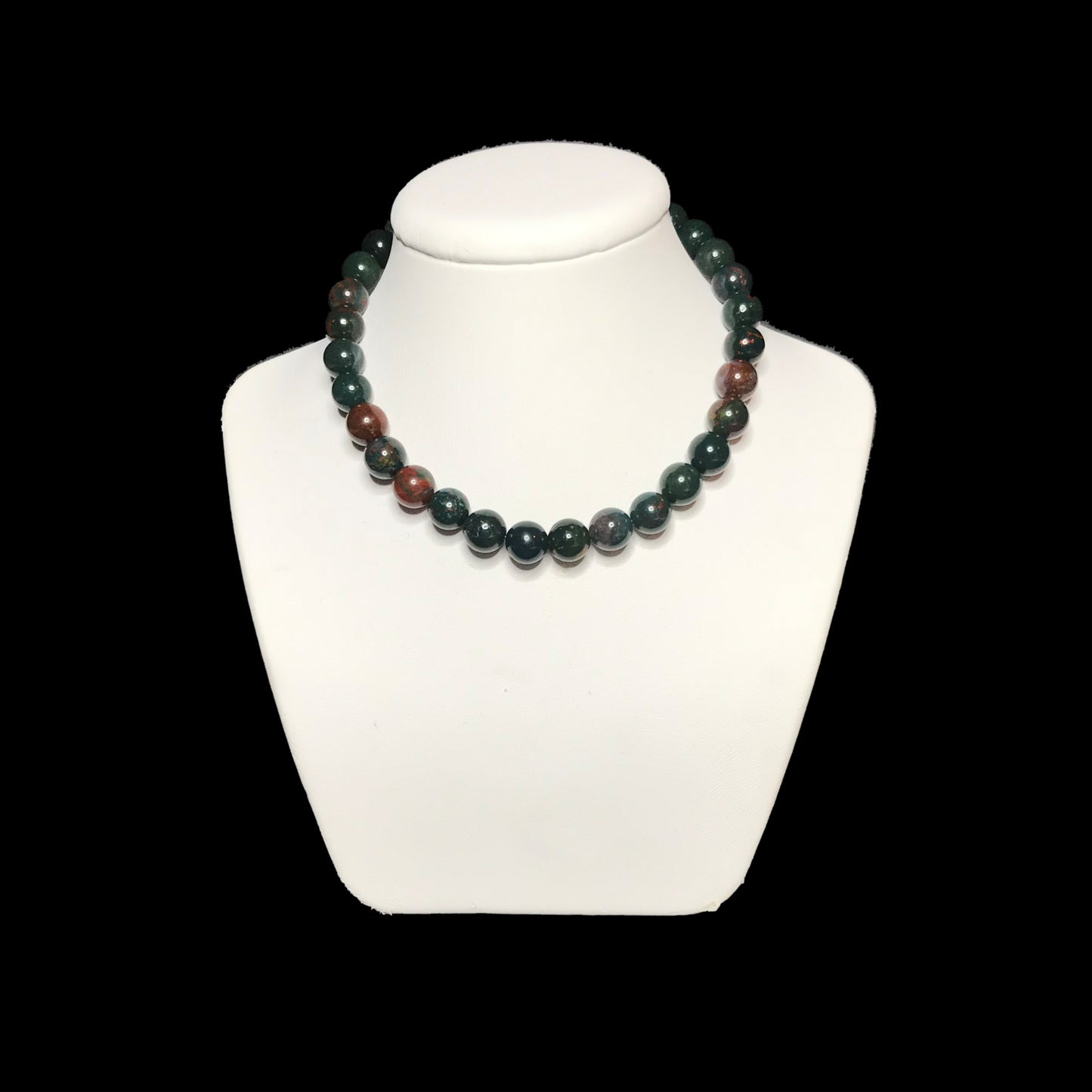 Bloodstone bead necklace on white stand