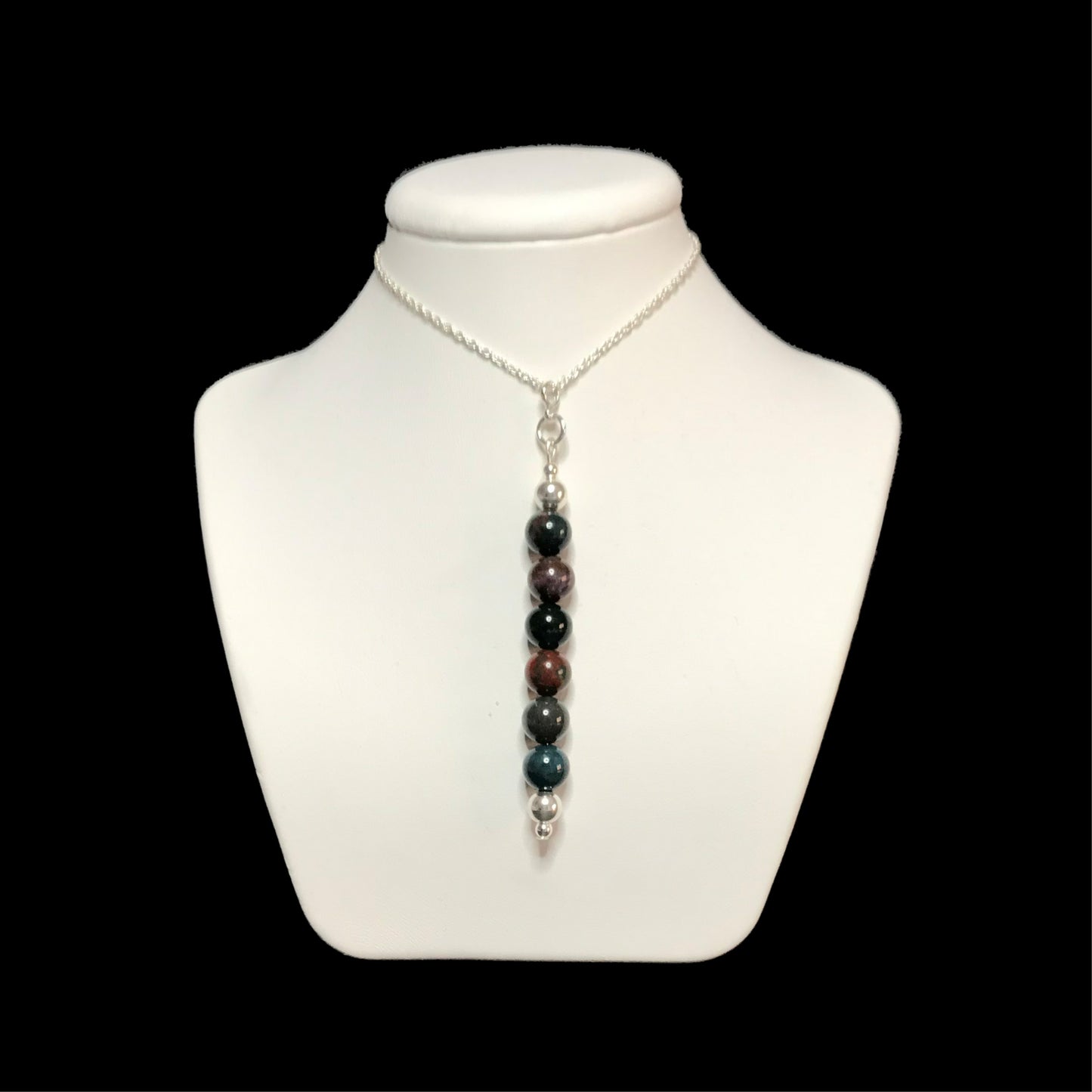 Bloodstone pendant necklace on white stand