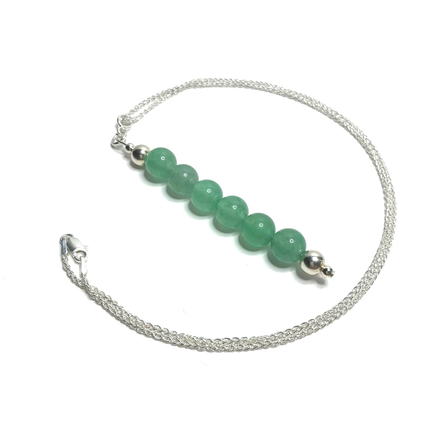 Green aventurine gemstone pendant on a silver chain