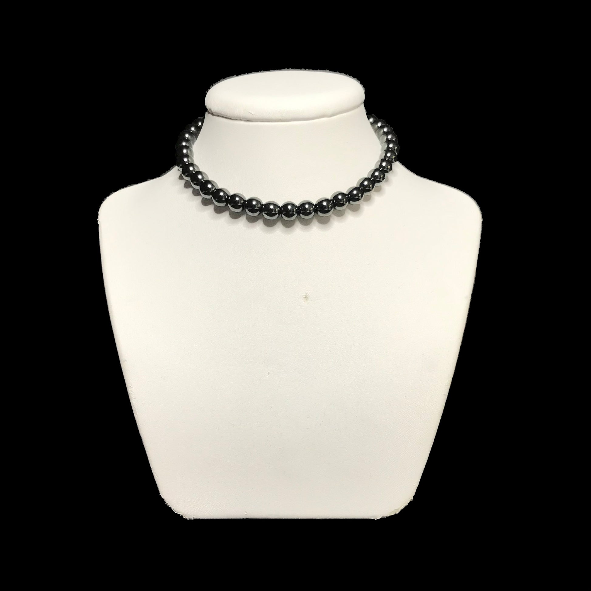 Hematite choker on stand