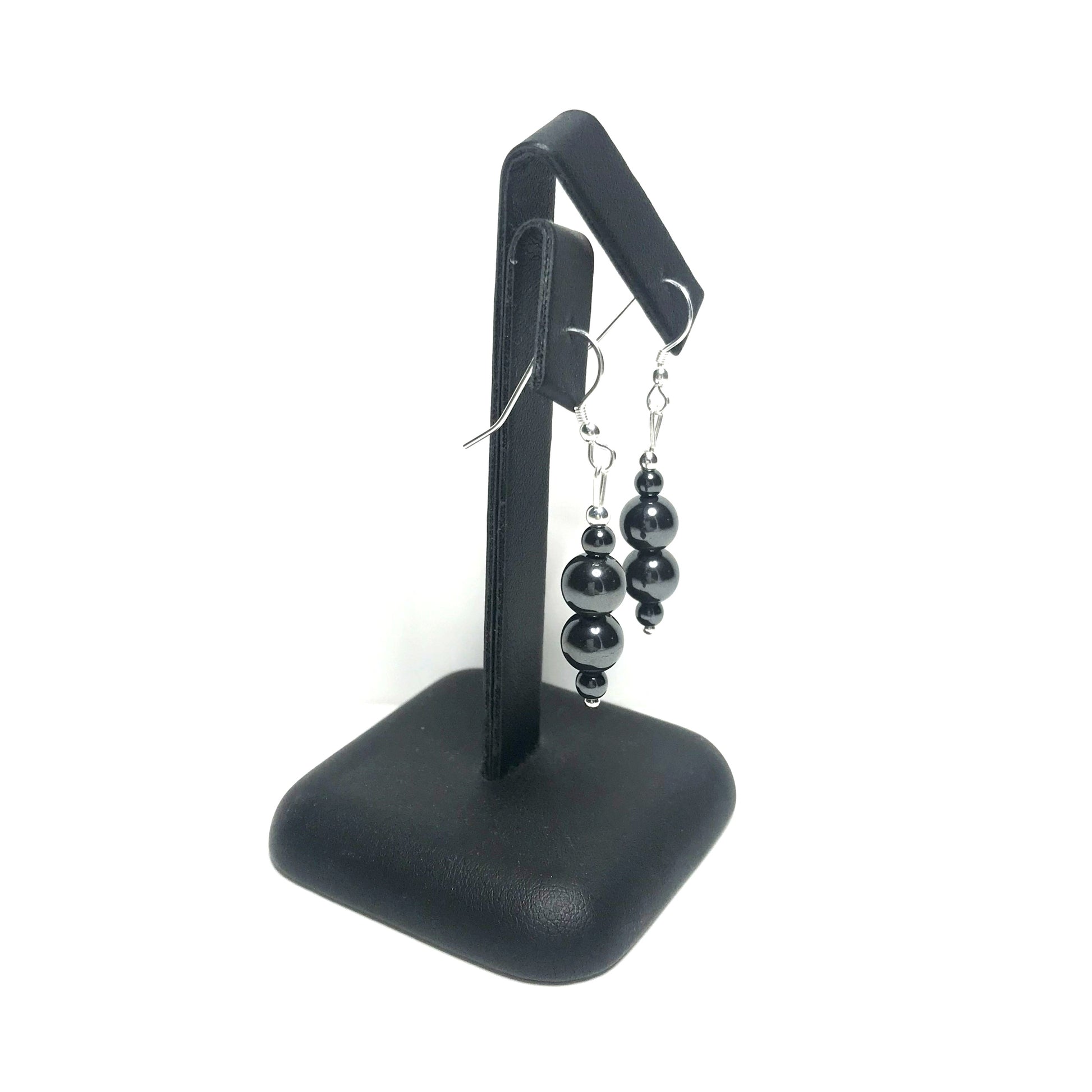 Hematite drop earrings on stand