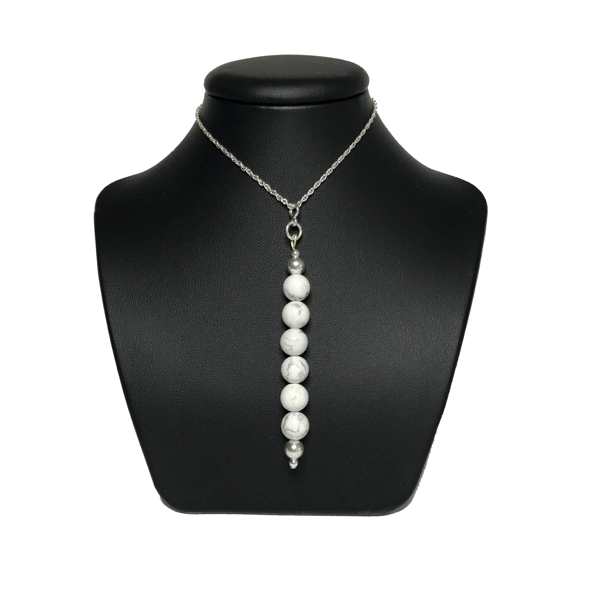 Howlite pendant necklace on stand