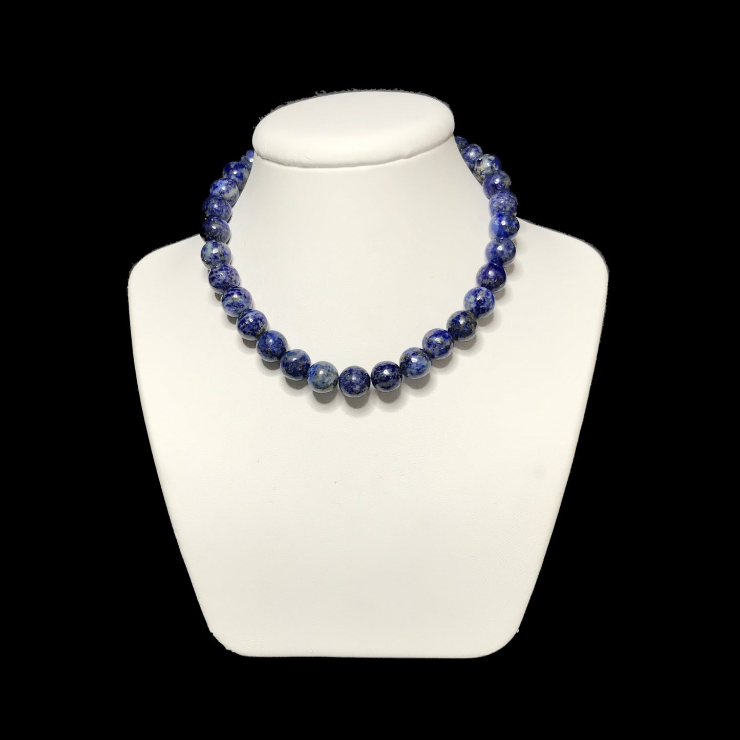 Lapis lazuli crystal necklace on stand