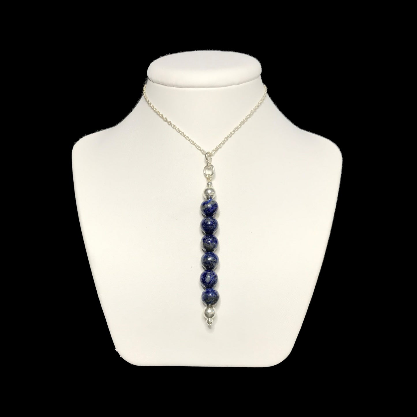 Lapis lazuli pendant necklace on stand