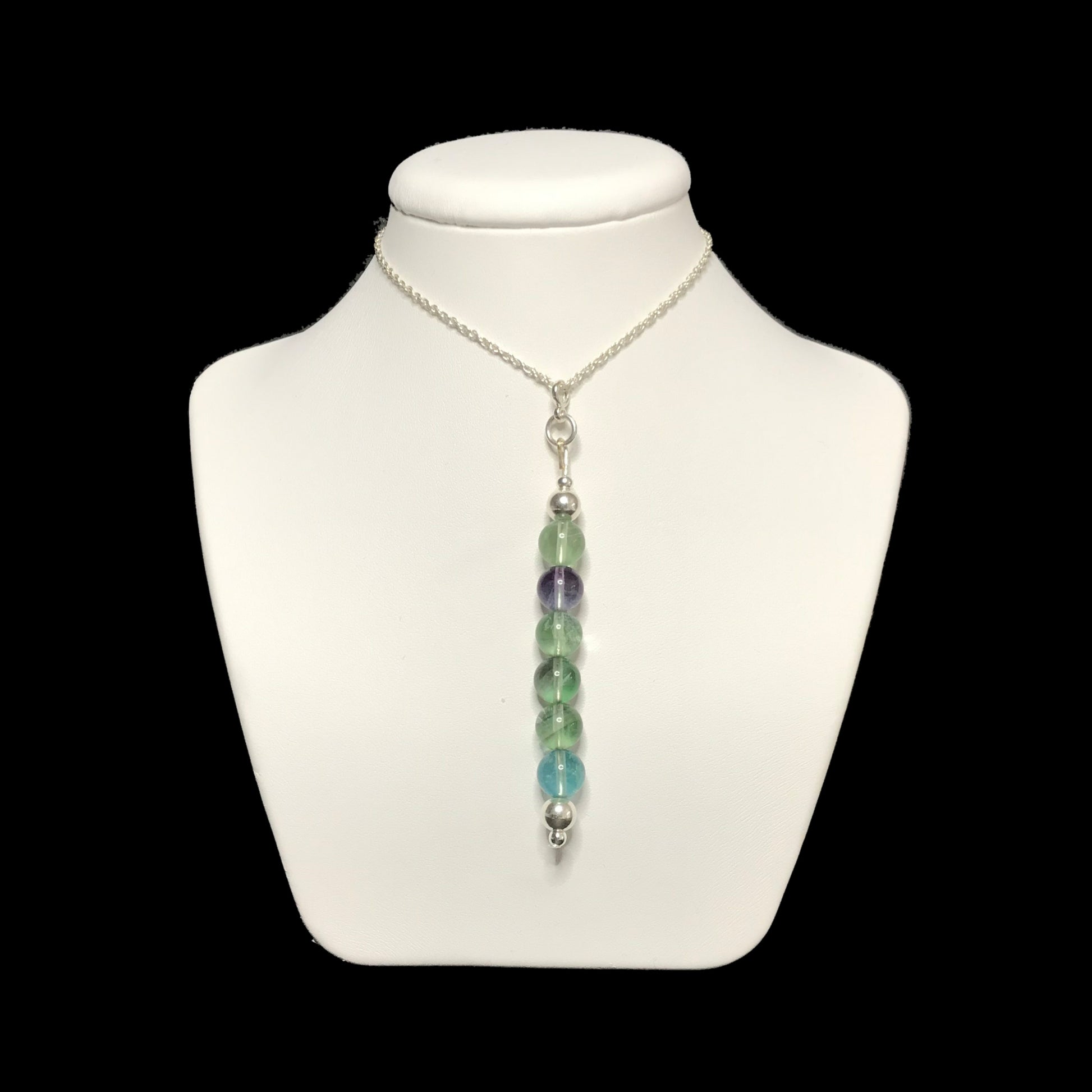 Rainbow fluorite pendant necklace on stand