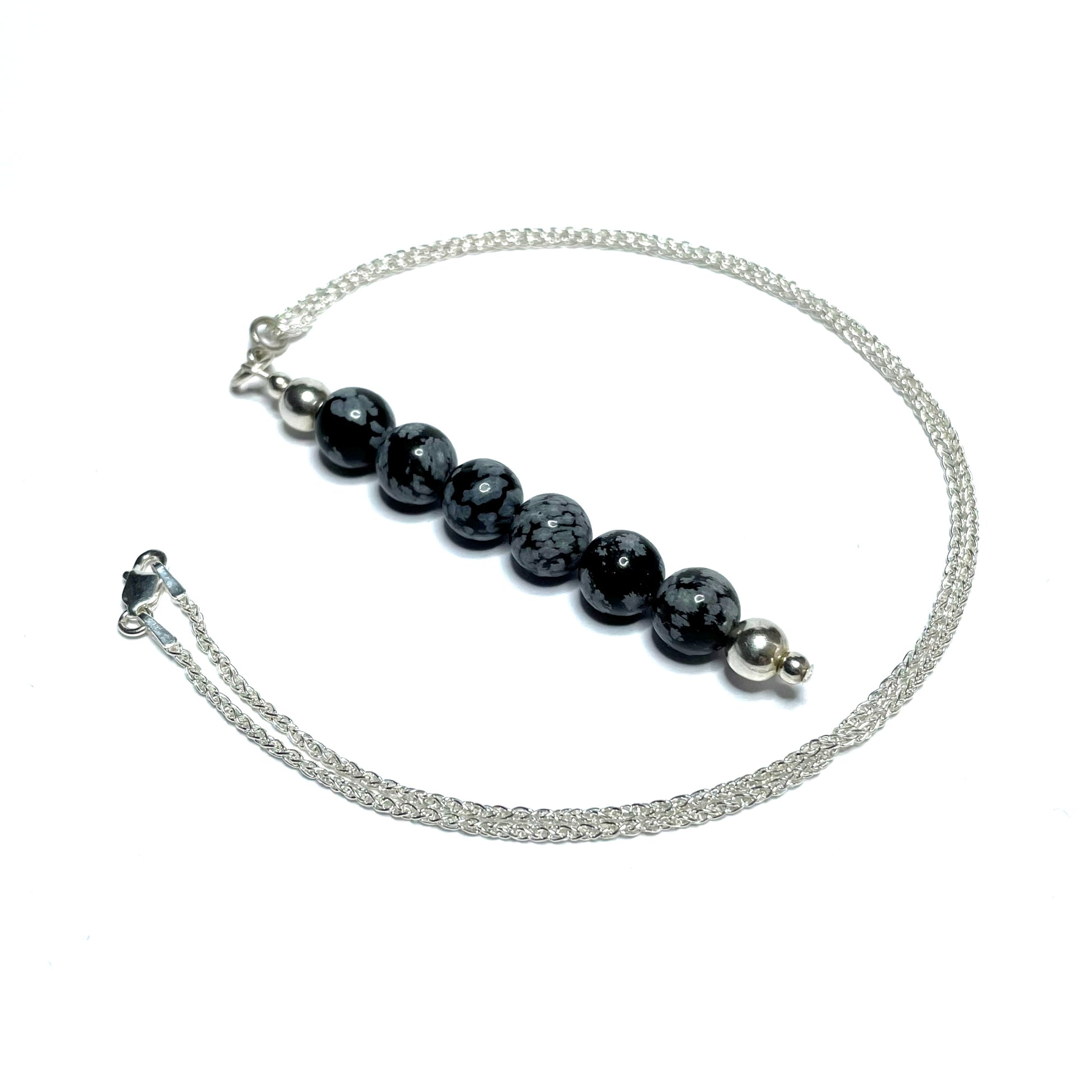 Snowflake obsidian beaded pendant on a silver chain