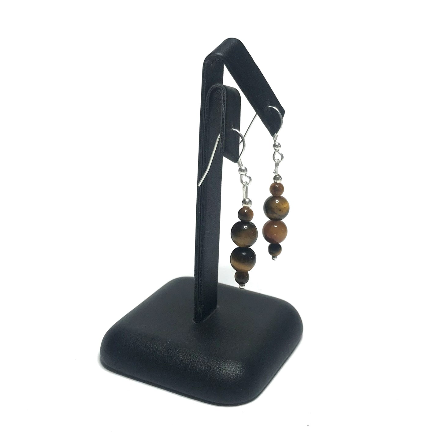 Tiger eye drop earrings on stand