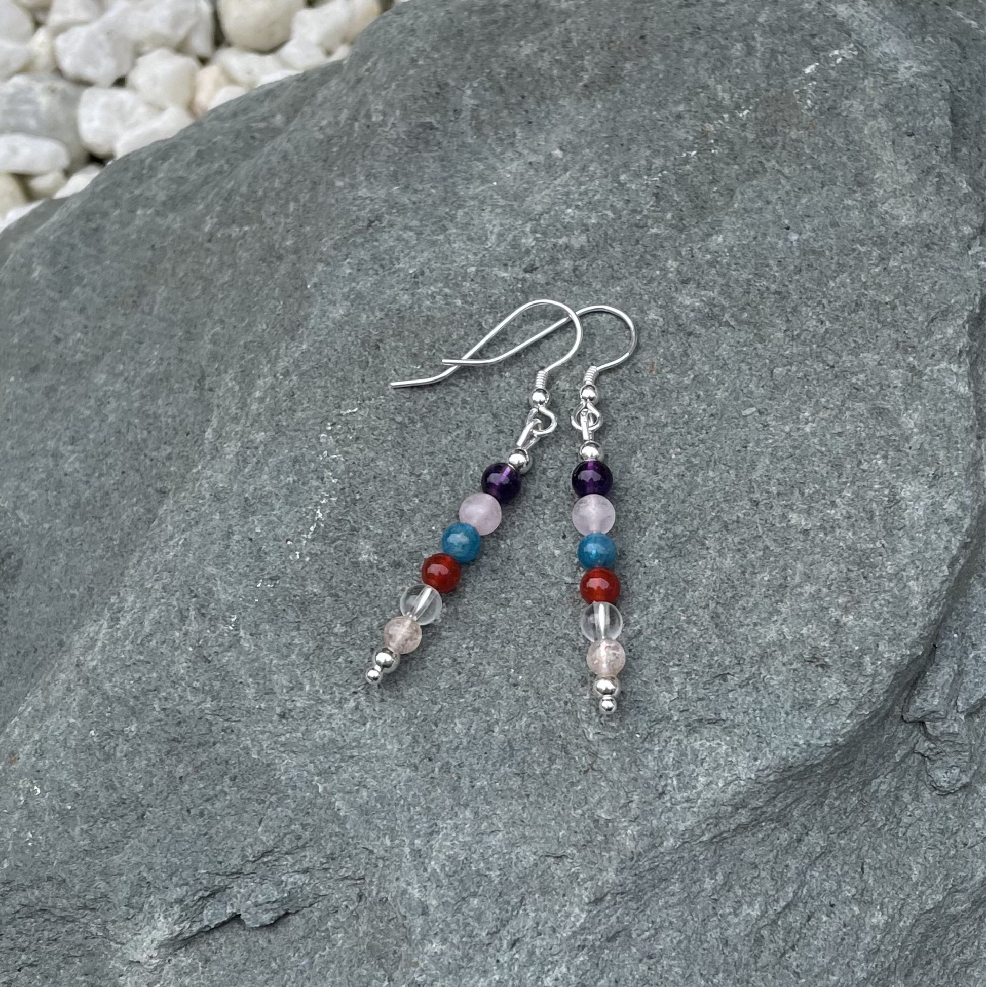 Weight loss gemstone earrings on stone