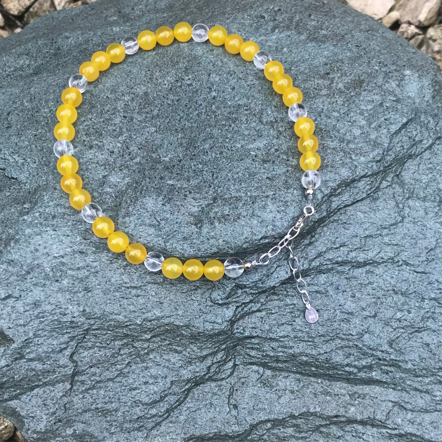 Yellow agate anklet on stone