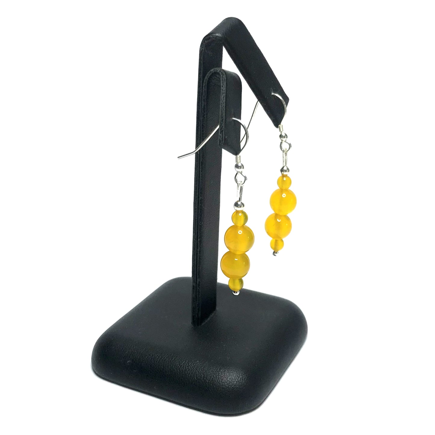 Yellow agate dangle earrings on stand