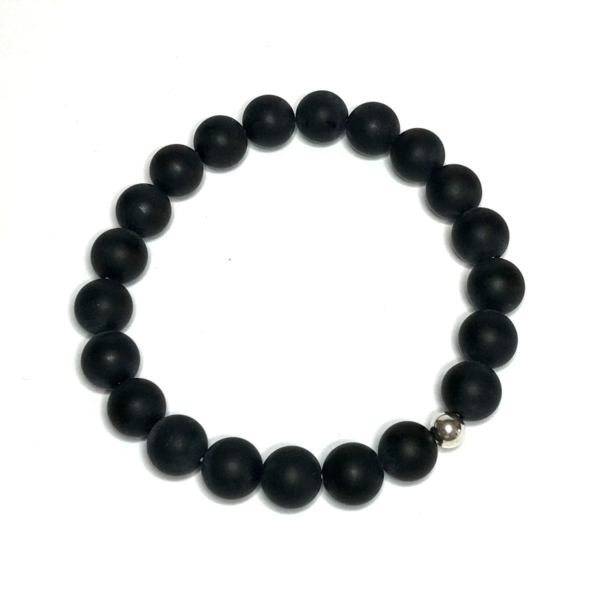 Handmade 10mm matte onyx bracelet on white background from above